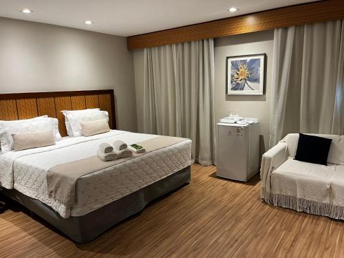 Кровать или кровати в номере Flat SP no Hotel Wyndham Ibirapuera - Moema