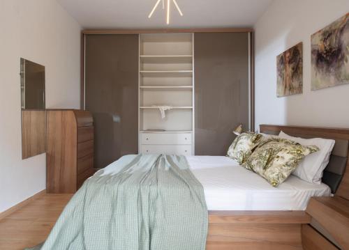 a small bedroom with a bed and a closet at Lakis House Nikiti in Nikiti