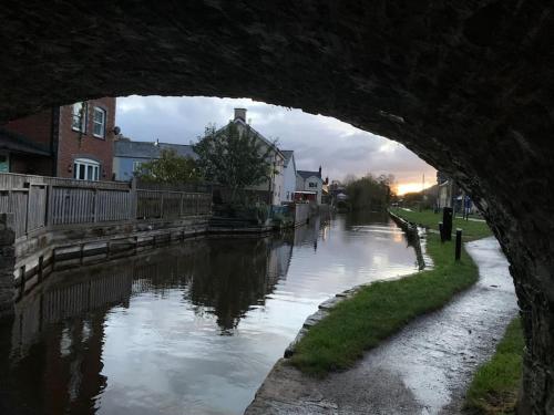 a view of a river under a bridge at Mountain views in the heart of Brecon Town in Brecon