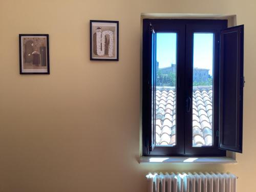 a window in a room with a radiator at La casa di B in Paganica