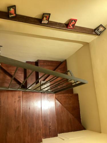 a staircase in a room with a wooden door at La casa di B in Paganica