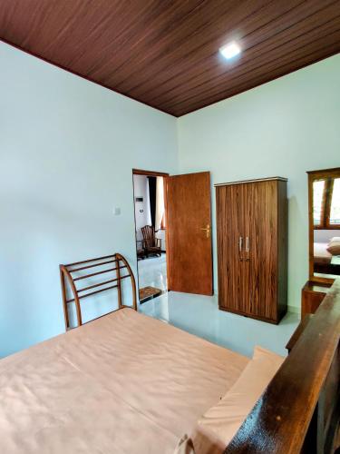 Katil atau katil-katil dalam bilik di Highway Twin Home West wing