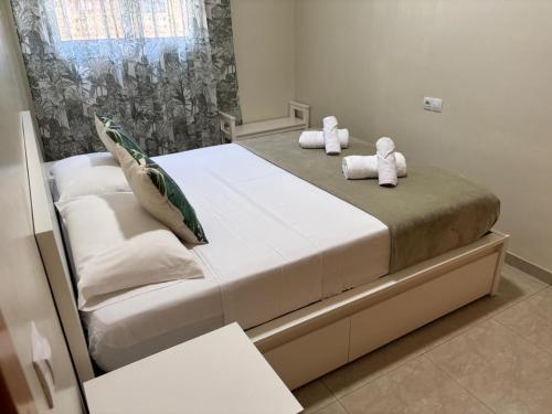 a bedroom with a bed with two teddy bears on it at Family Relax Salou in Salou