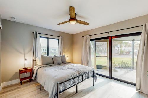 a bedroom with a bed and a ceiling fan at Sunrise Bay Escape in Fort Myers Beach