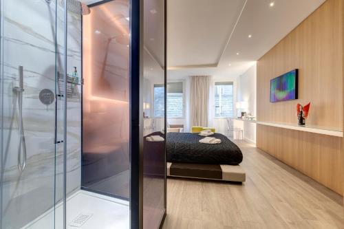 a bathroom with a shower and a bed in it at Apartment Suite Piazza Signoria in Florence