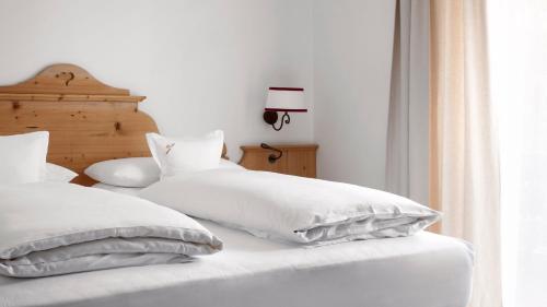 Cama o camas de una habitación en Hotel Tyrol