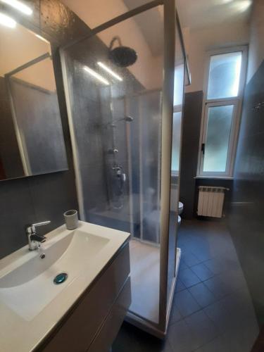 a bathroom with a shower with a sink and a shower at Varazze Centro in Varazze