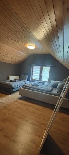 a bedroom with two beds in a room at Gästehaus Spring Herznach in Herznach