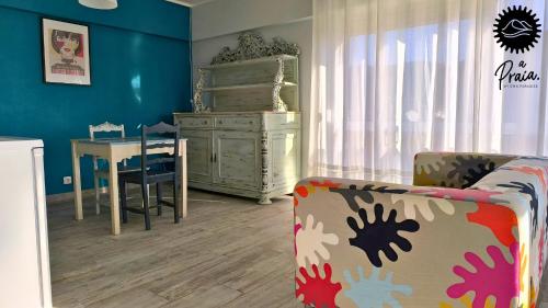 a childs room with a table and a dresser at A Praia, My Own Paradise- Estúdio in Figueira da Foz