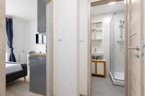 a bathroom with a shower and a sink at Apartmán u metra s terasou in Prague