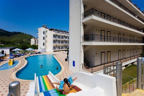 a group of people on a slide in a swimming pool at Ares Blue Hotel in Kemer