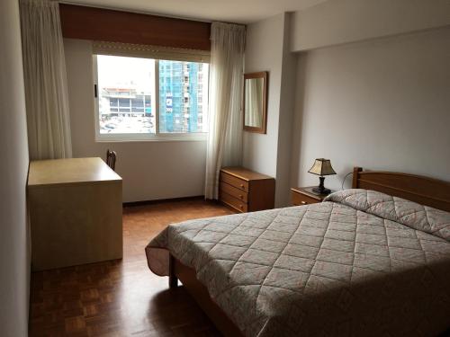 a hotel room with a bed and a window at Riazor San Roque de Afuera in A Coruña