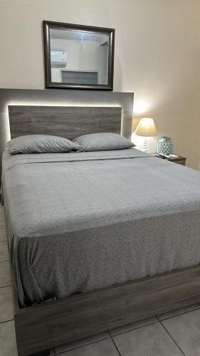 Ένα ή περισσότερα κρεβάτια σε δωμάτιο στο Playa Apartments