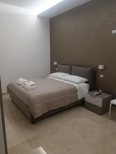 מיטה או מיטות בחדר ב-Villa Matilde Monteroni