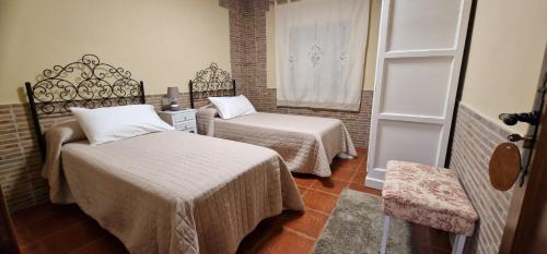 Postel nebo postele na pokoji v ubytování Apartamento Turistico "El Rincón de la Pernila"