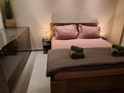 a bedroom with a bed with two pillows on it at Guest house del Mar in Iraklitsa