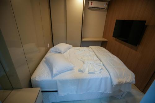 Postel nebo postele na pokoji v ubytování Foz Cobertura 3 suítes e Foz Apartamento 2 suítes