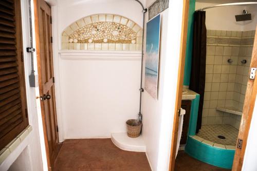 a bathroom with a toilet and a shower at Sayulita Central Hotel in Sayulita