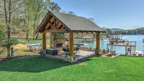a large gazebo with a grill and a lake at Lake Cove Oasis in Morganton