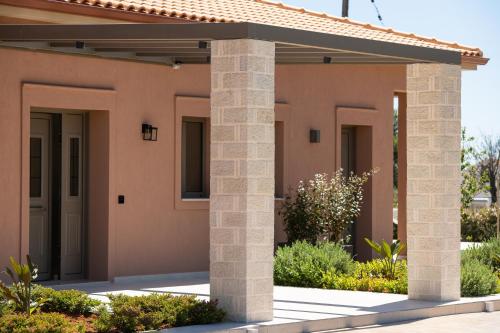 a rendering of a house with columns at Reveli Suites in Katelios