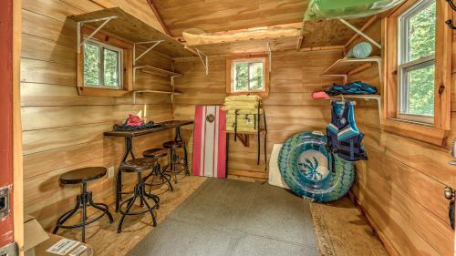 a log cabin with a bar and stools in it at Lake Escape in Morganton
