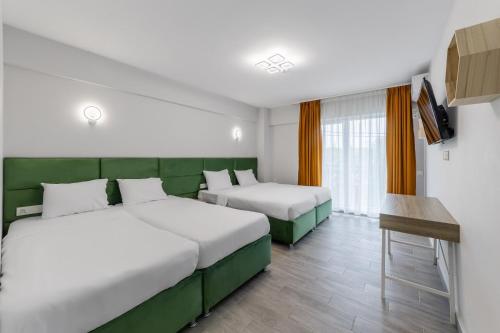 Postel nebo postele na pokoji v ubytování Otopeni Suites by CityBookings