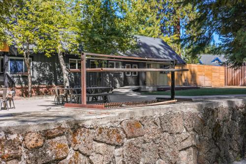 a stone wall in front of a building at Shasta View Lodge in McCloud