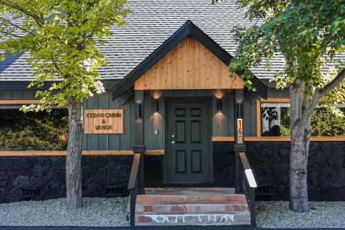 a building with a green door with a sign on it at Shasta View Lodge in McCloud