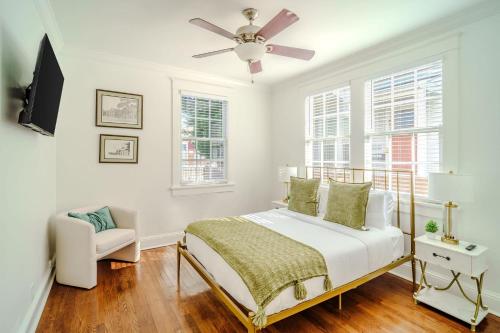 a bedroom with a bed and a ceiling fan at Chic & Central - Renovated Gem with Gated Parking in New Orleans