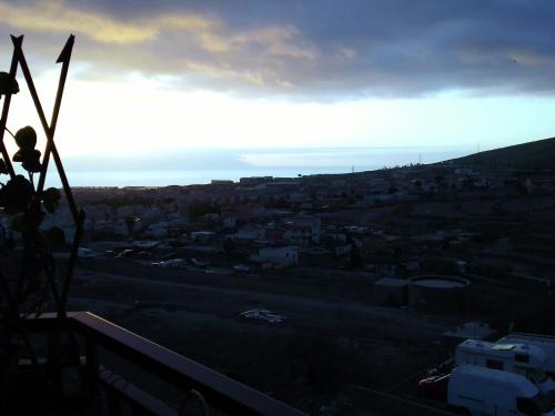 a view of a city with the sun setting at Mi Rincón Favorito in Adeje
