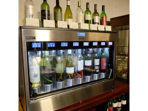 a refrigerator filled with lots of bottles of wine at Hotel Takimoto - Vacation STAY 43492v in Yamanouchi
