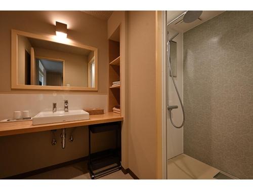 a bathroom with a sink and a shower at Hotel Takimoto - Vacation STAY 43490v in Yamanouchi