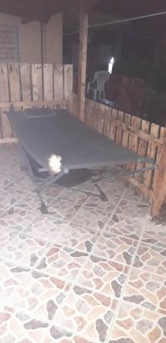 a ping pong table sitting on top of a floor at Biky's room's in Moudhros