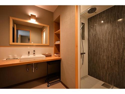 a bathroom with a sink and a shower at Hotel Takimoto - Vacation STAY 43491v in Yamanouchi