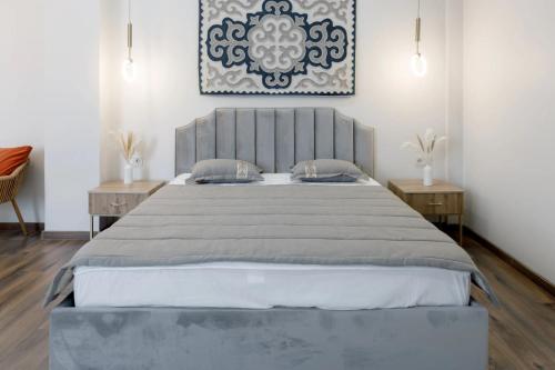 Кровать или кровати в номере Tumar Hansa Ethno Hotel