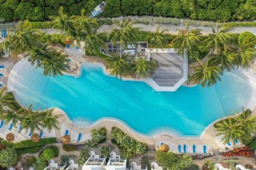 an aerial view of a resort with a swimming pool at Vacay Vibes-2 Pools, Pickleball, Coffee Bar, 2 Jacuzzis, Food Truck in Key Largo
