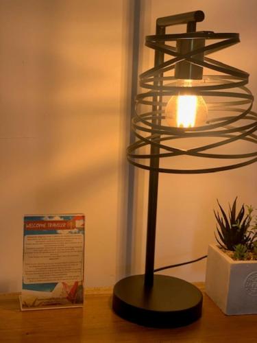 a glass lamp sitting on a table next to a box at Rincon del Mar Palomino in Palomino