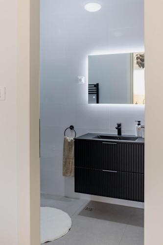 a bathroom with a sink and a mirror at A Riduli in Split