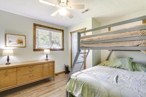 a bedroom with a bunk bed and a dresser at Cottage with Yard and Grill about 21 Mi to Hocking Hills! in Nelsonville