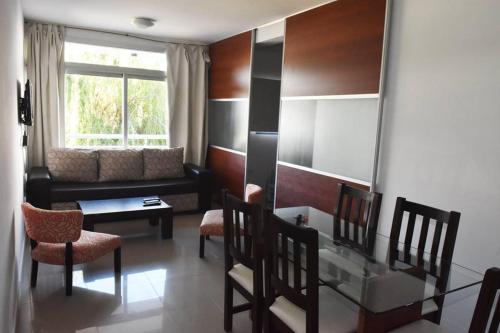 a living room with a couch and a table at San Isidro in Viedma
