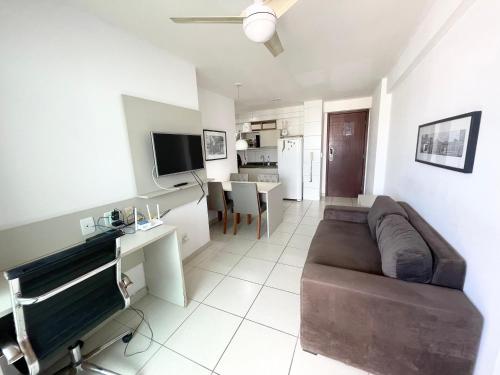 a living room with a couch and a table at Flat beach Class conselheiro Aguiar in Recife