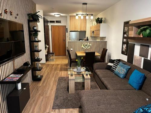 a living room with a couch and a table at Exclusive Central Apartment with Private Garden in Budapest