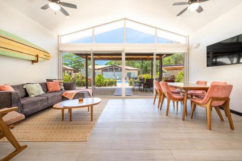 a living room with a couch and a table at The Breakhouse in Playa Avellana