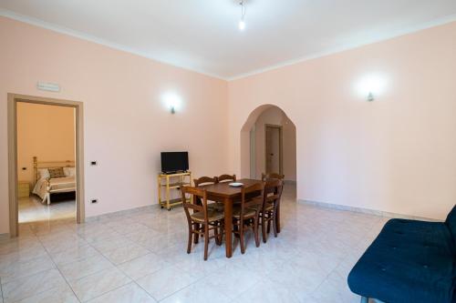 a dining room with a table and chairs at Grace's House in Acireale