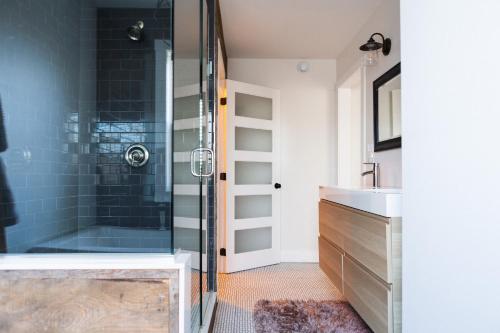 a bathroom with a shower and a sink at Woodland Chase in Wellington