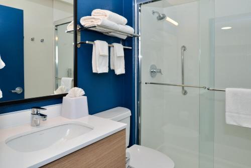 a bathroom with a sink and a shower at Spark By Hilton Dallas Medical District Love Field in Dallas