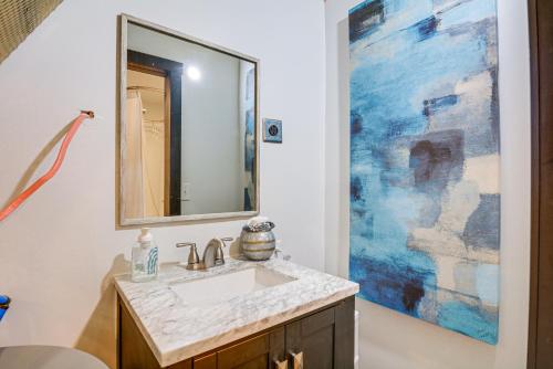 a bathroom with a sink and a large mirror at One-of-a-Kind Container Home on Century Farm! in Mount Vernon