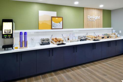 a dental office with a counter with food on it at Spark By Hilton Dallas Medical District Love Field in Dallas
