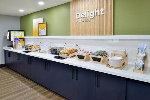 a buffet line in a dental office with food on it at Spark By Hilton Dallas Medical District Love Field in Dallas