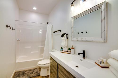 a bathroom with a sink and a toilet and a mirror at Lakefront Pagosa Springs Escape Near Hiking Trails in Pagosa Springs